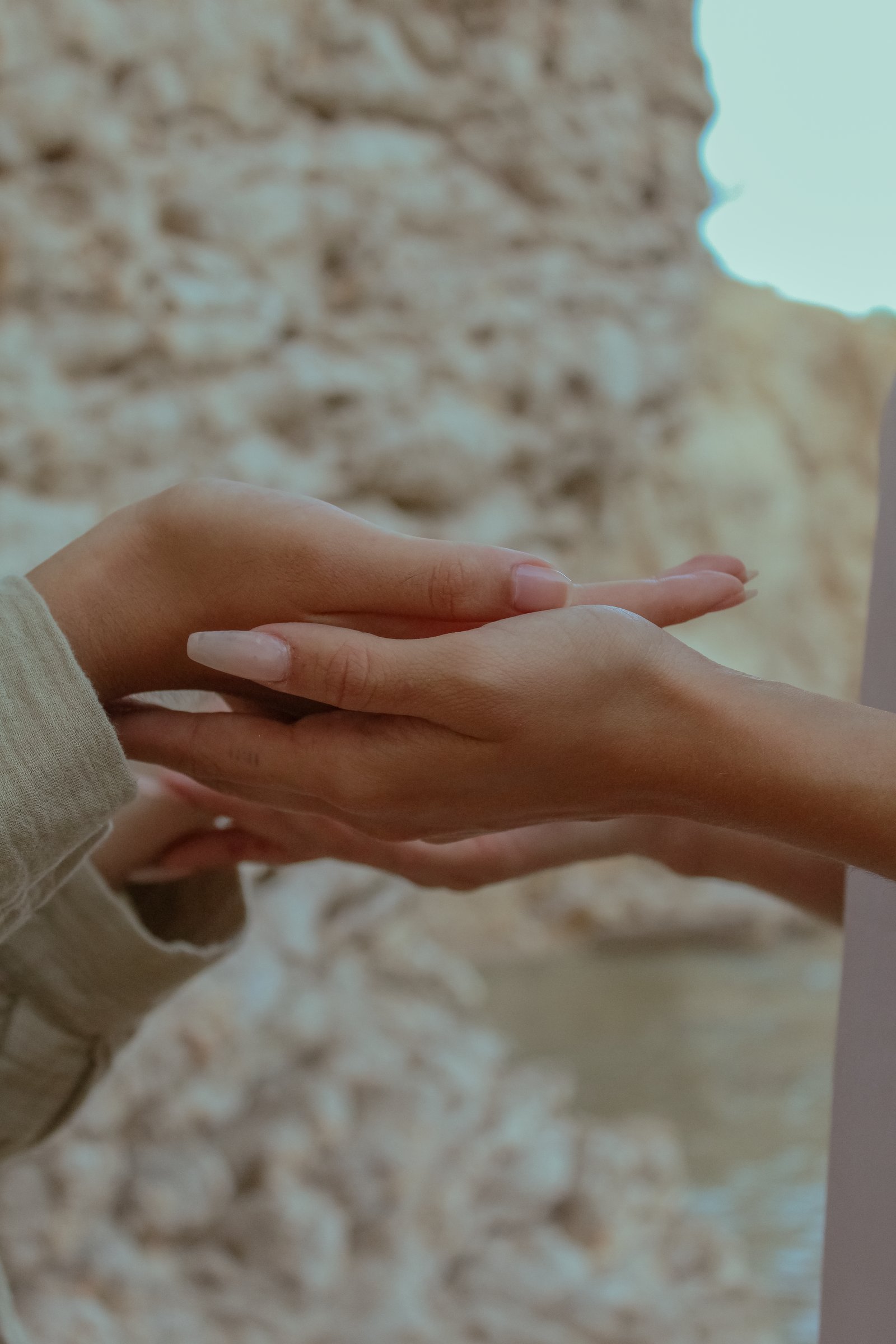 Two hands touching, detail