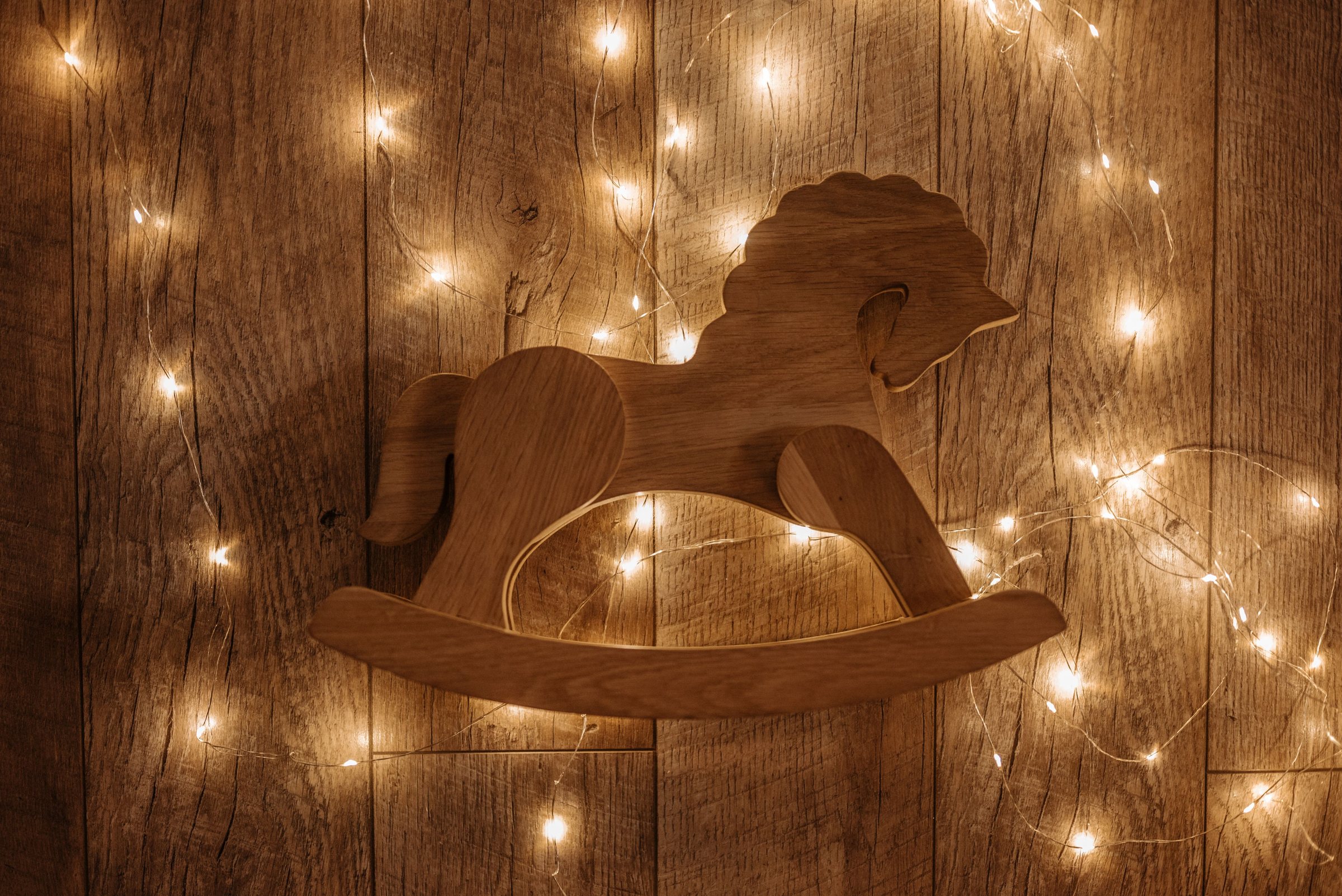Wooden rocking horse with fairy lights