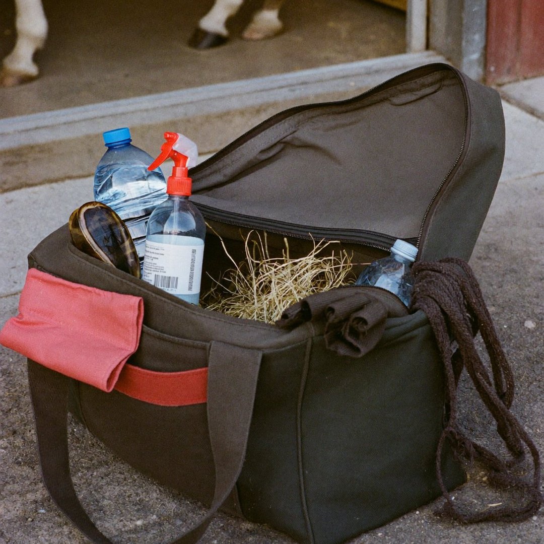An open tack bag among everyday yard kit